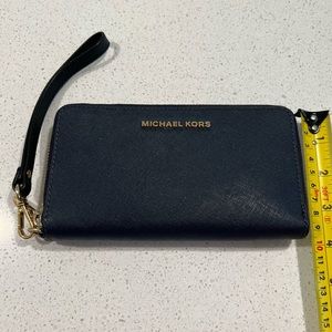 Michael Kors zipper wristlet wallet. Navy luggage leather. Excellent condition.